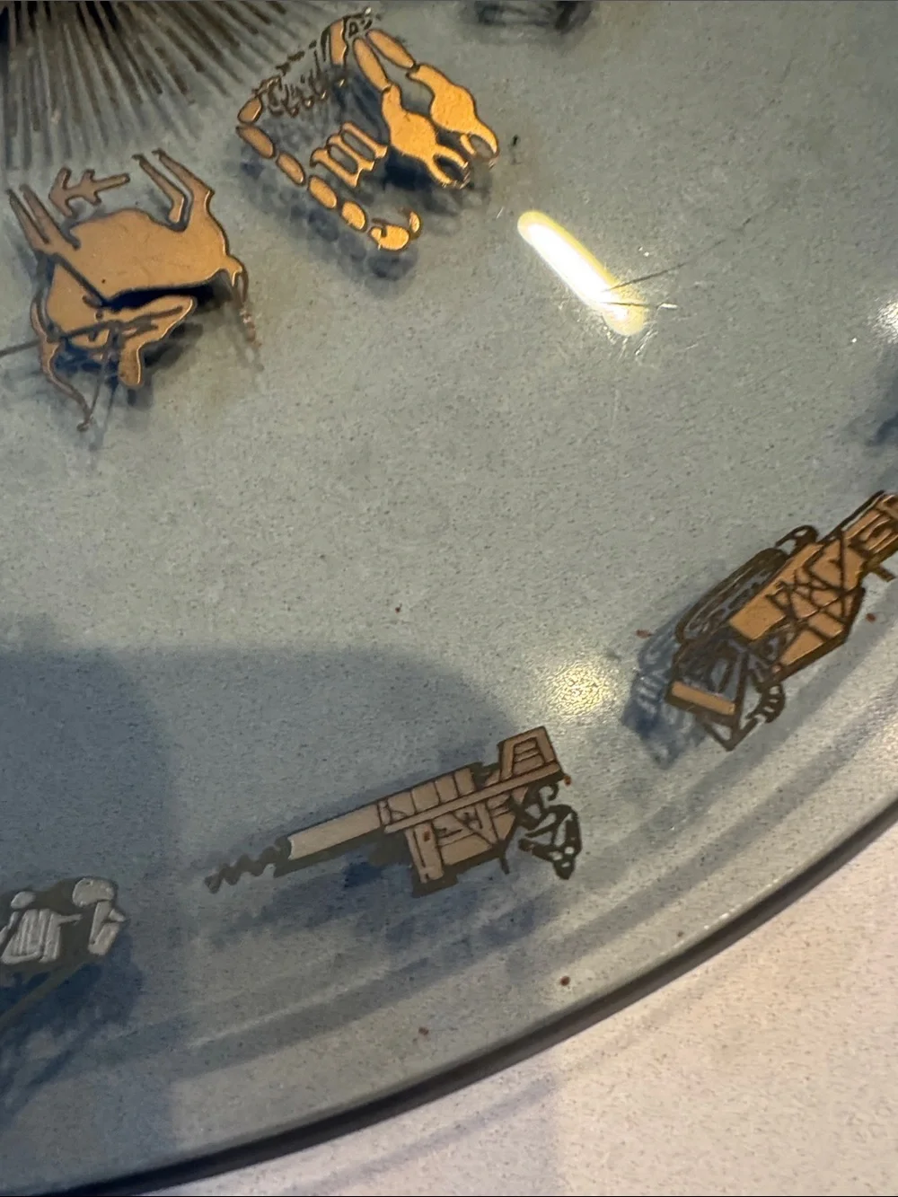 Glass Decorative Plate with Gold Zodiac Accents and heavy equipment